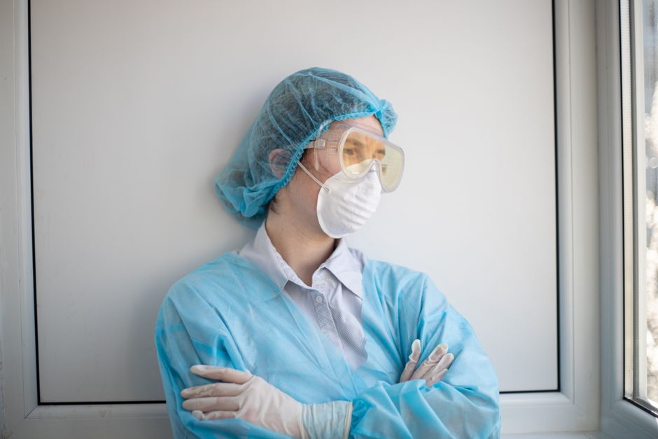 Hospital staff demonstrating protective equipment used for infectious disease isolation