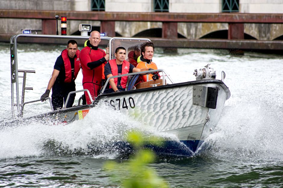 A small rescue boat on open water during a search operation