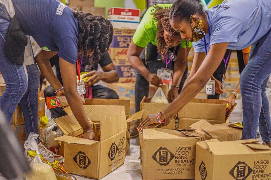 Volunteers pack food boxes for families at a community food pantry