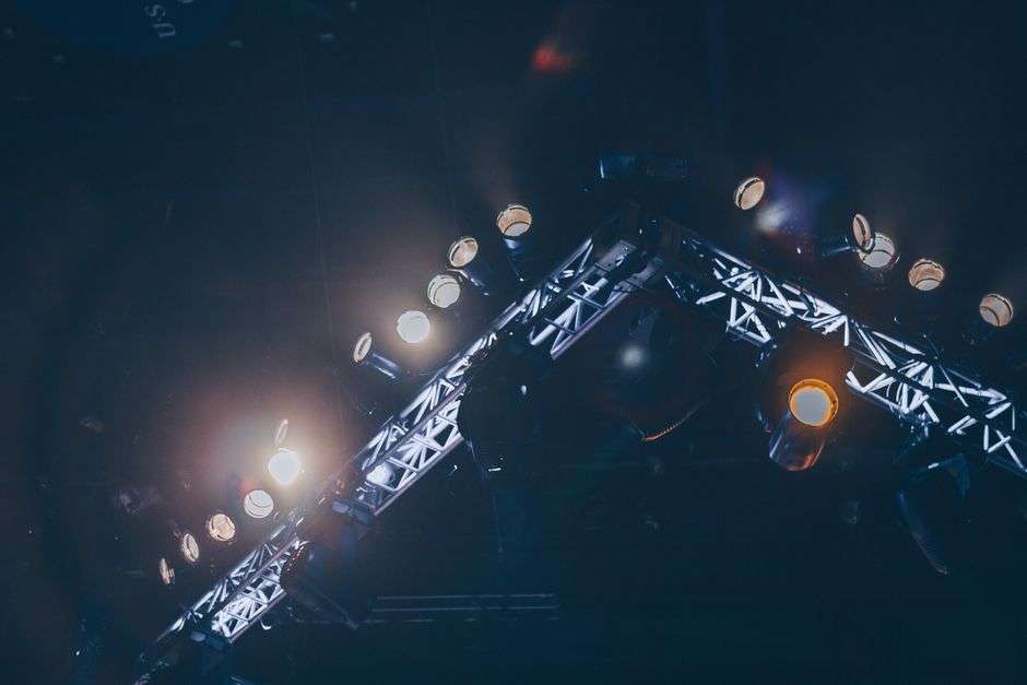 Stage lights illuminate a concert venue ahead of a live music performance