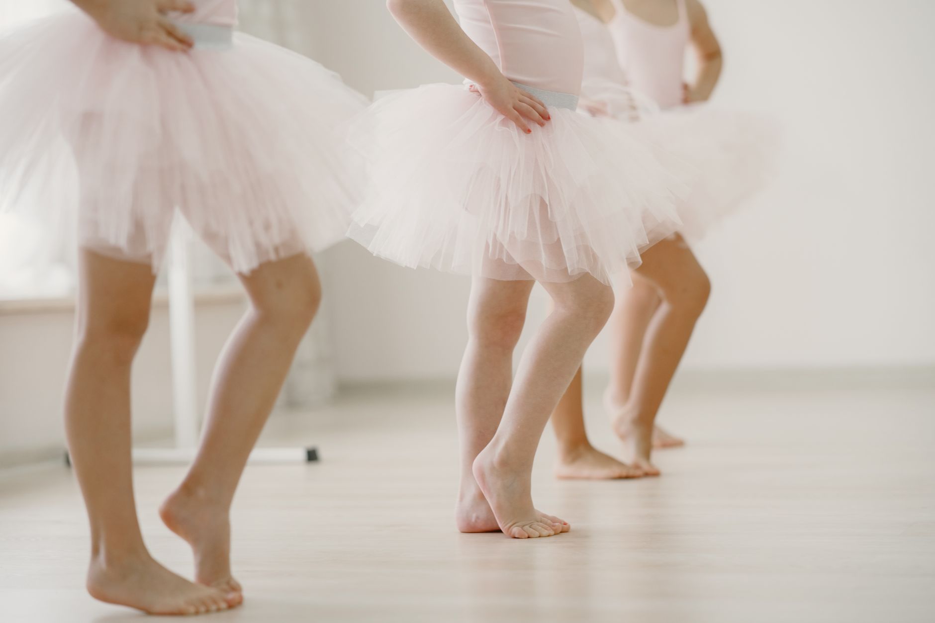 Young performers rehearsing on stage, illustrating the Youth on the Winning Side summer arts intensive in Mobile, Alabama