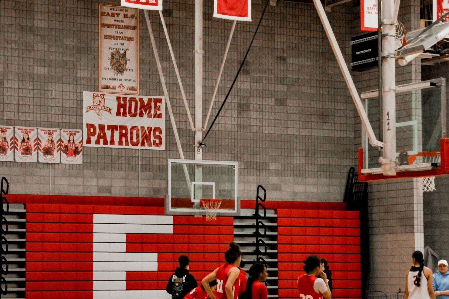 High school basketball players competing inside a school gymnasium in Alabama