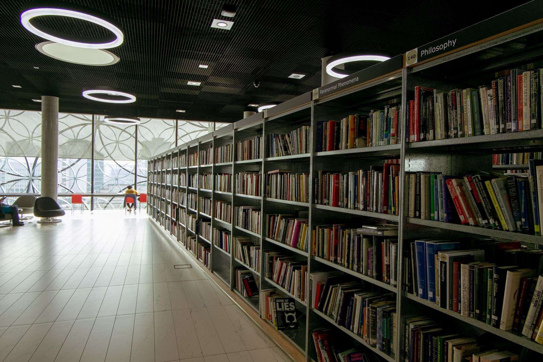 Rows of bookshelves inside a public library