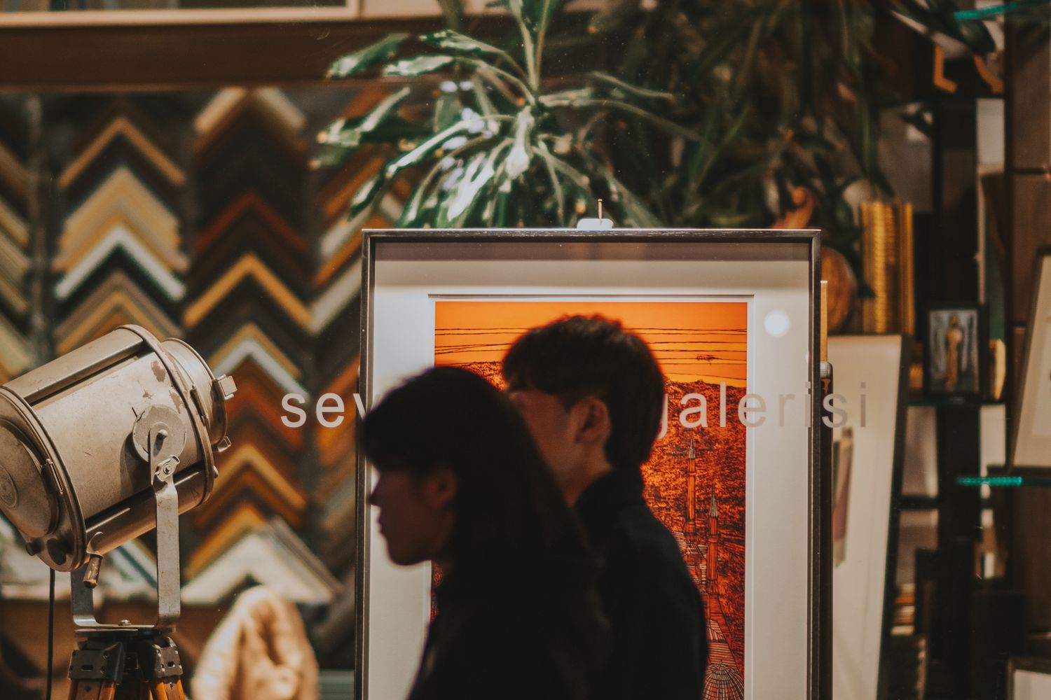 Visitors socializing at an art exhibition opening