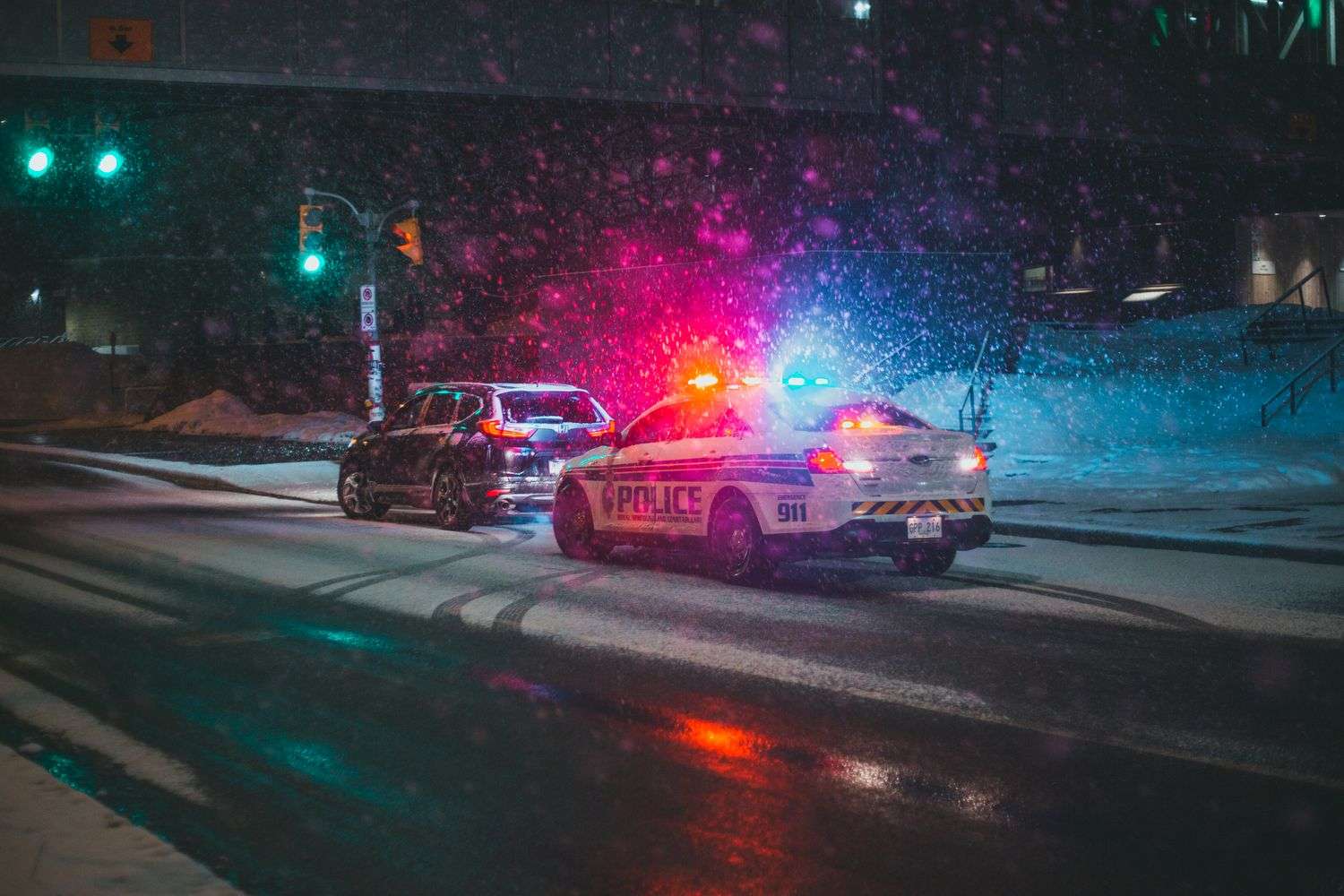 Police vehicles with flashing lights at a scene