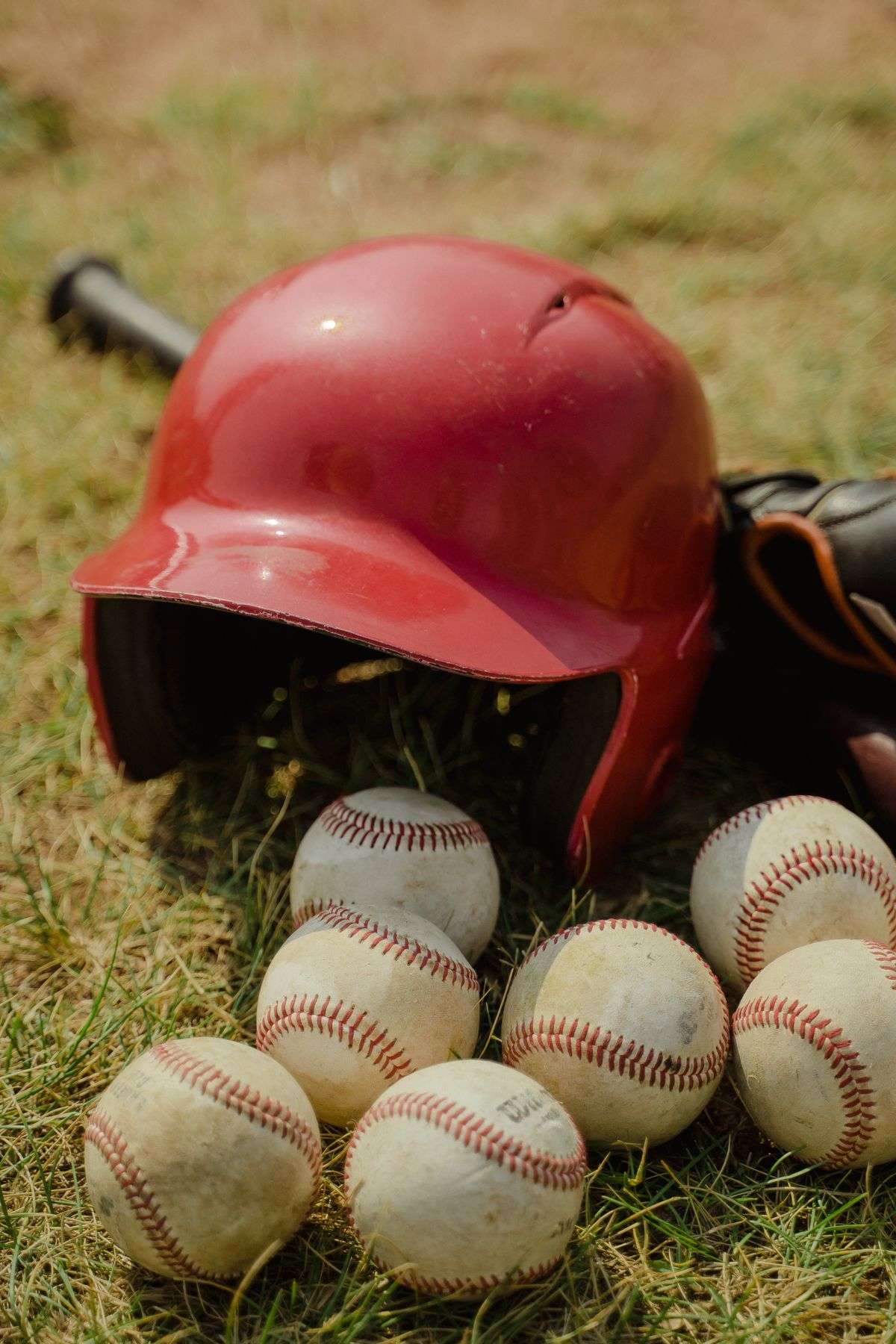 A young baseball player stepping up to the plate at a youth baseball tournament