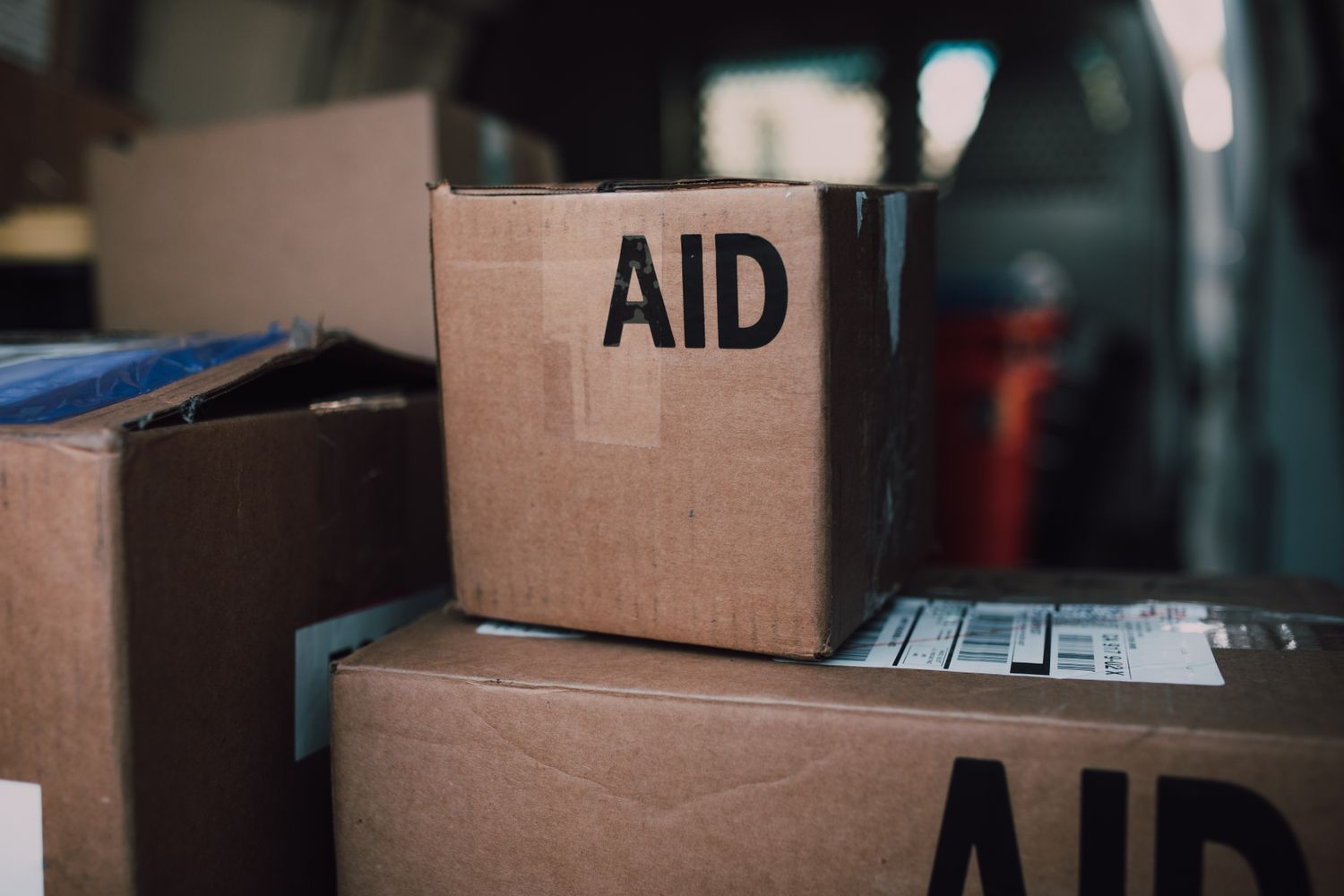Stacked shipping containers at a Gulf Coast port being loaded with donated supplies for hurricane relief