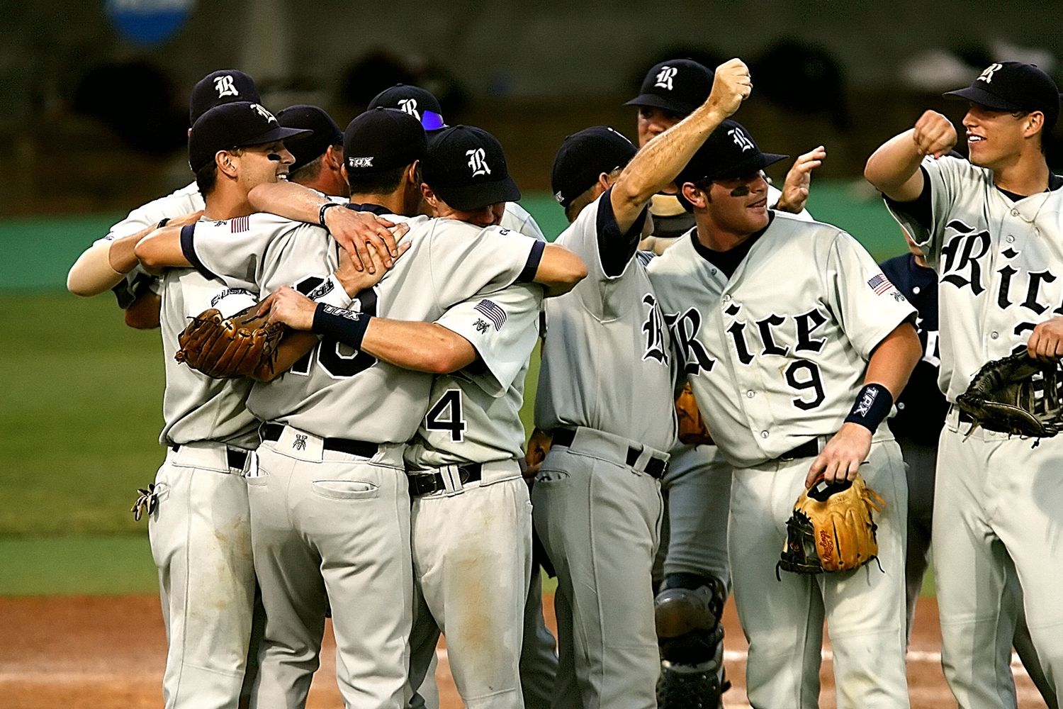 College baseball players compete during a collegiate athletics game