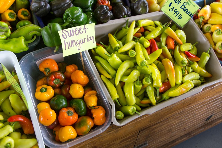 Fresh vegetables displayed at a local farmers market stand