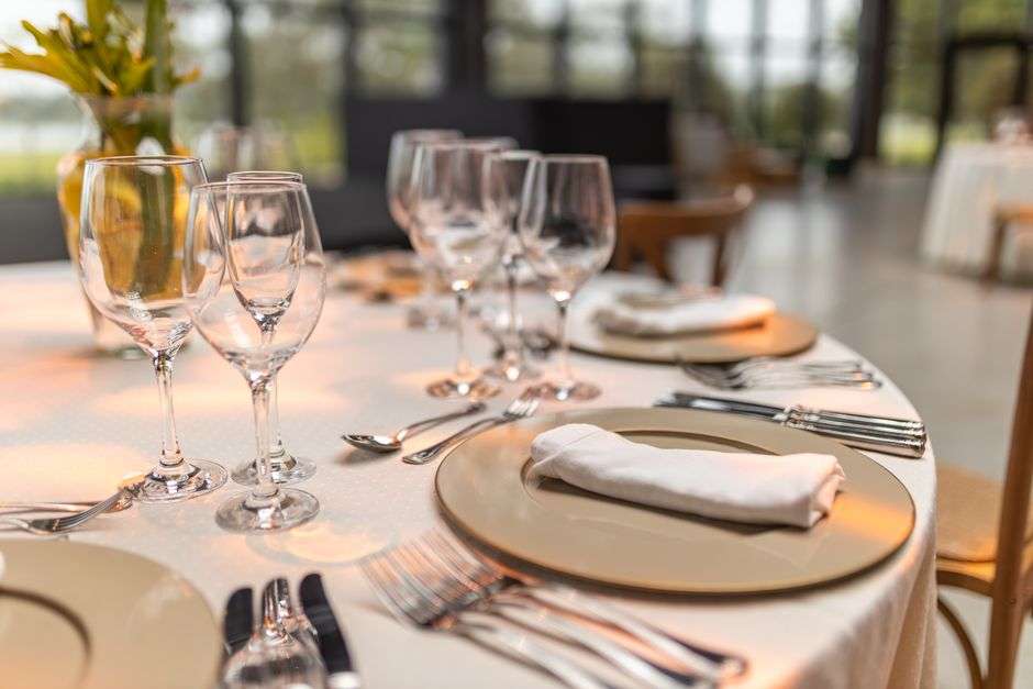 A banquet hall set for a dinner event