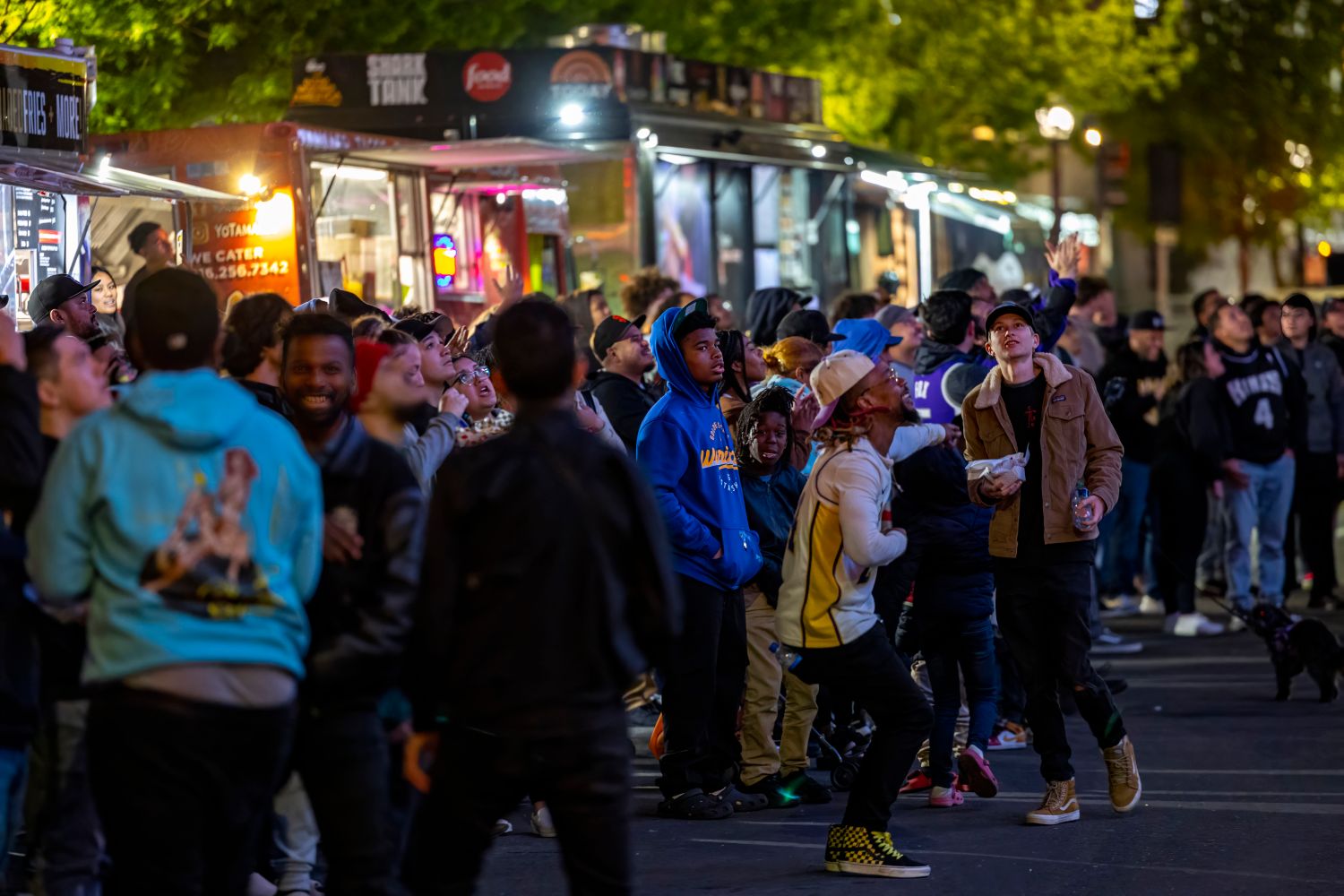 Food trucks lined up at an evening festival
