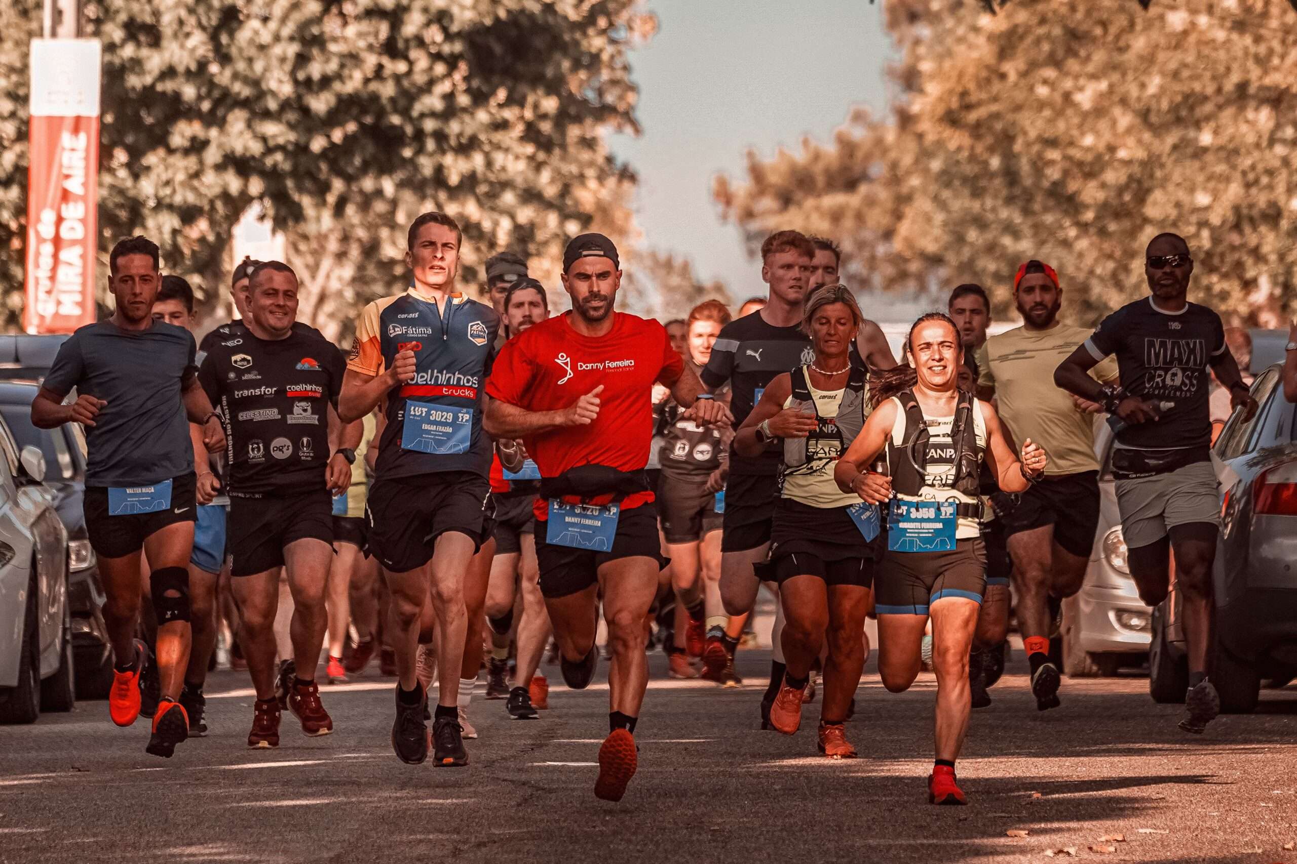 Runners moving through a city street during a downtown road race