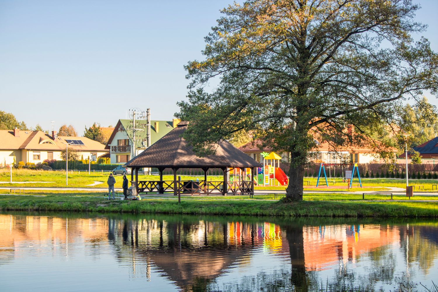 A playground area with pavilions at a waterfront county park