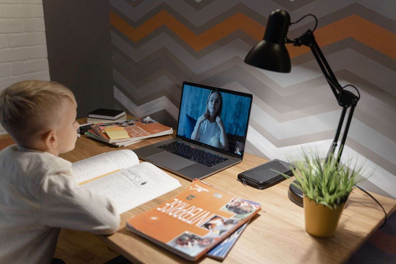 Child studying on a laptop during a virtual learning day