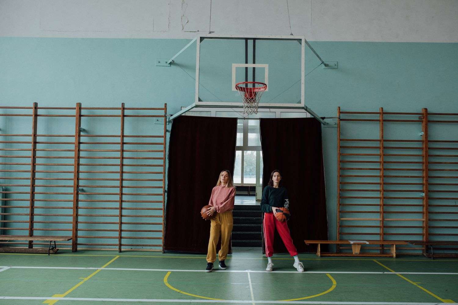 Community members gathered in a gymnasium for a basketball and resource event