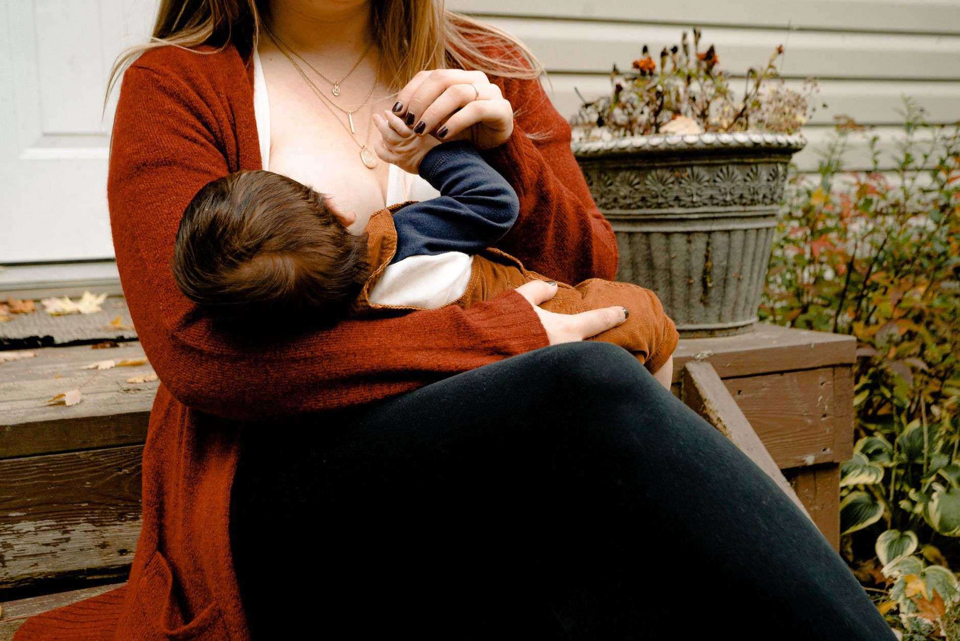 Mother breastfeeding her infant, representing National Breastfeeding Awareness Month