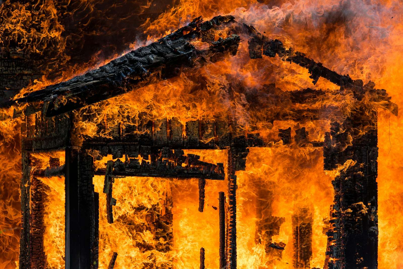Building engulfed in flames and heavy smoke