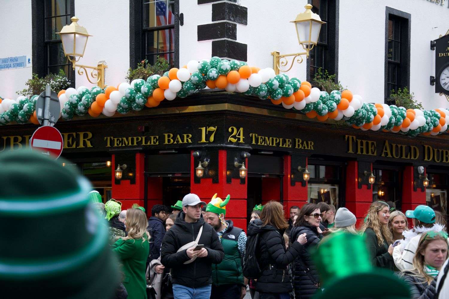 Crowd gathered outside an Irish pub