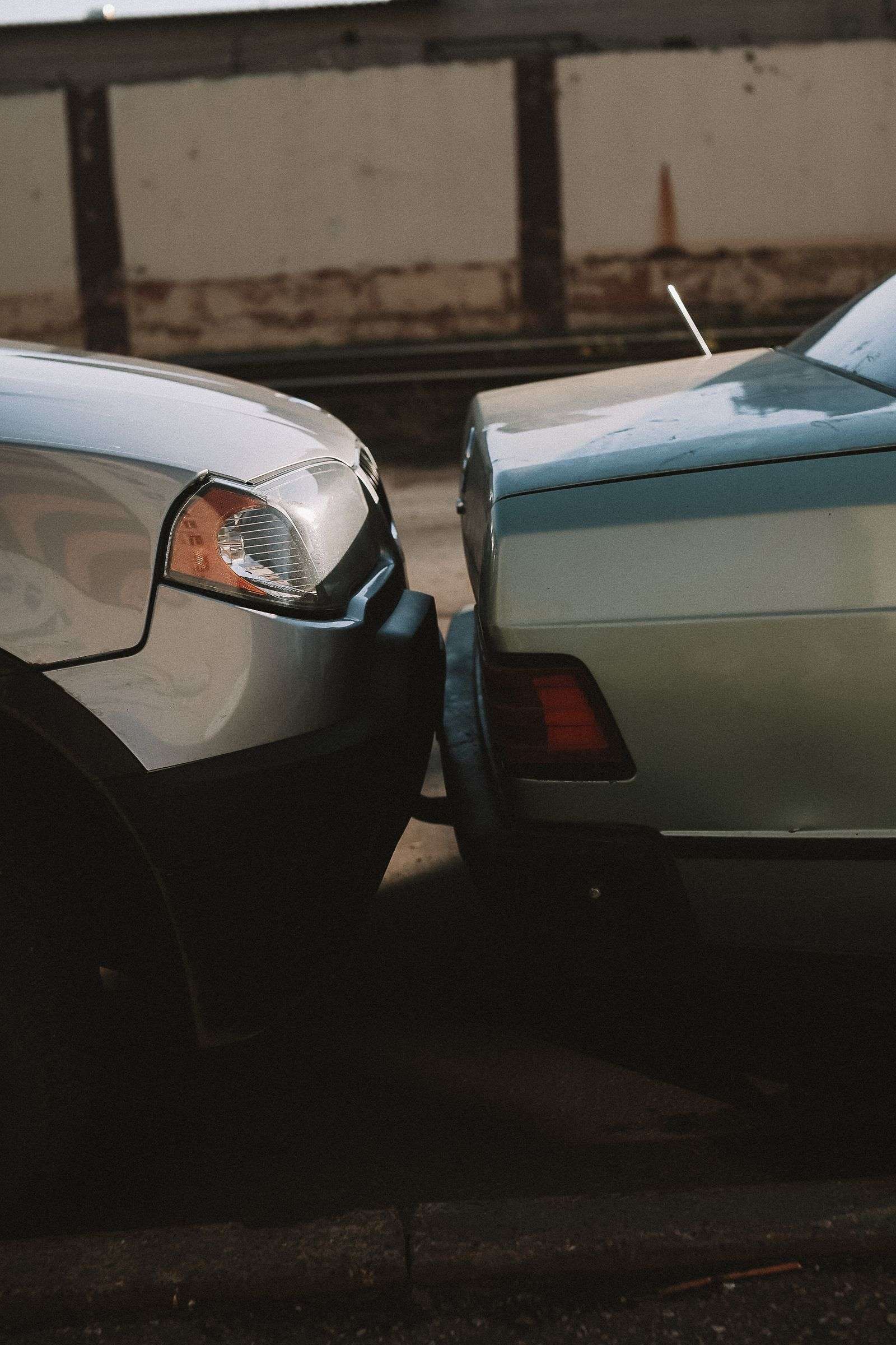 Damaged vehicles along the roadside following a multi-vehicle crash