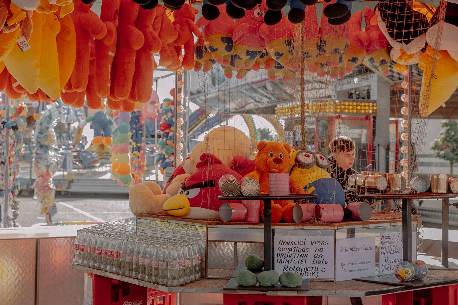 Carnival games and prizes line a street fair benefiting a local children's charity