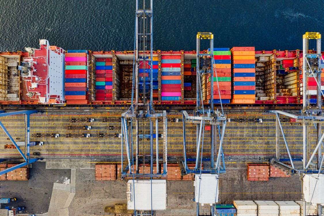 Aerial view of a cargo ship loaded with containers at a port