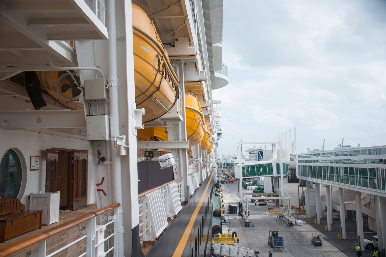 A quiet cruise ship docked at an empty terminal during the pandemic pause