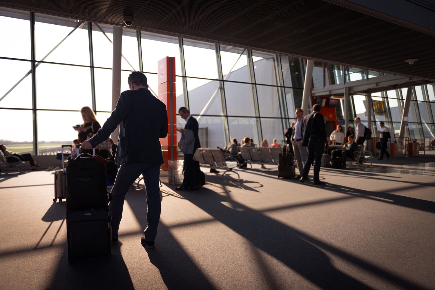 Cruise passengers waiting with their luggage at a port terminal