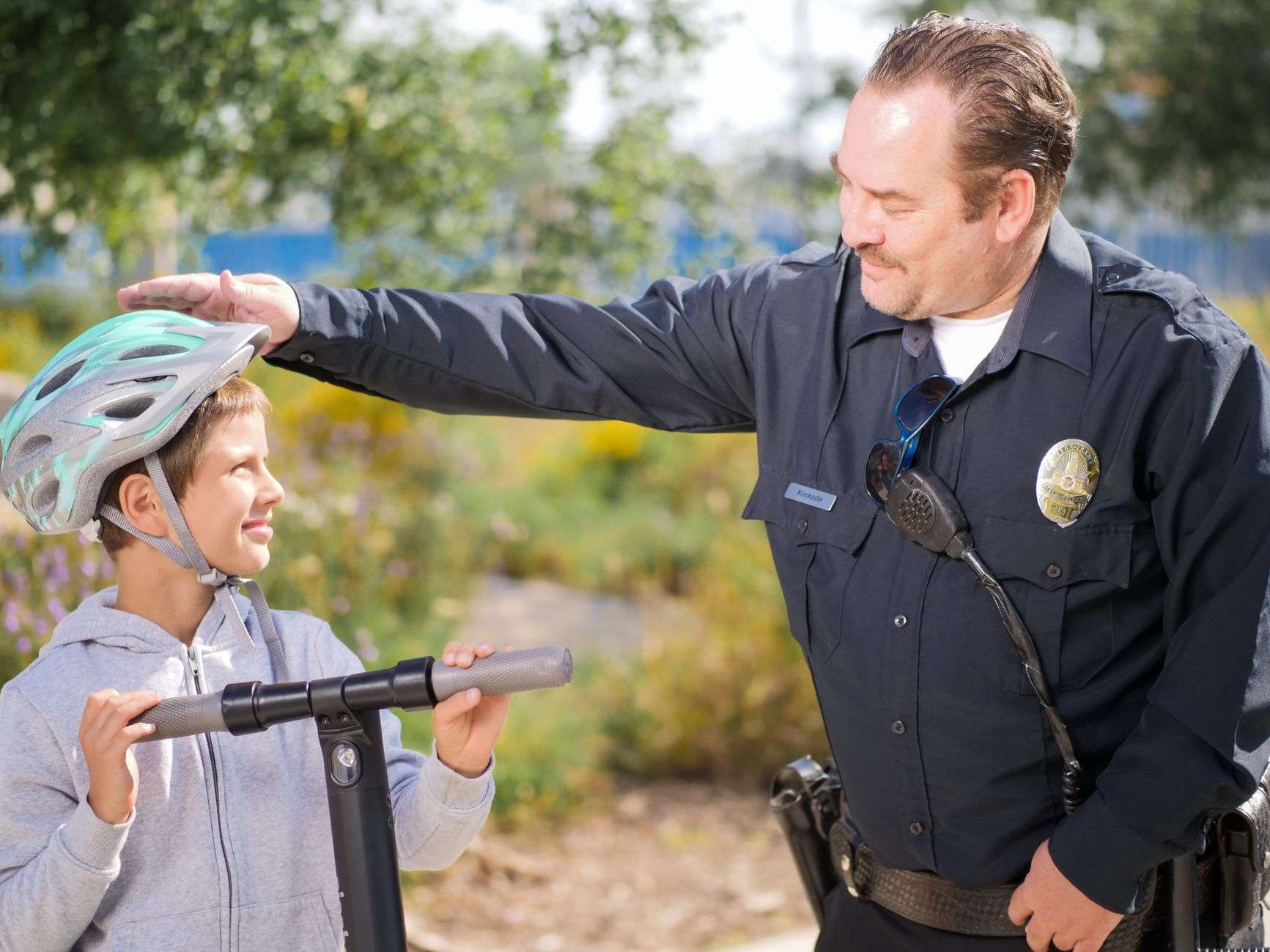 A law enforcement officer assisting during a roadside child medical emergency