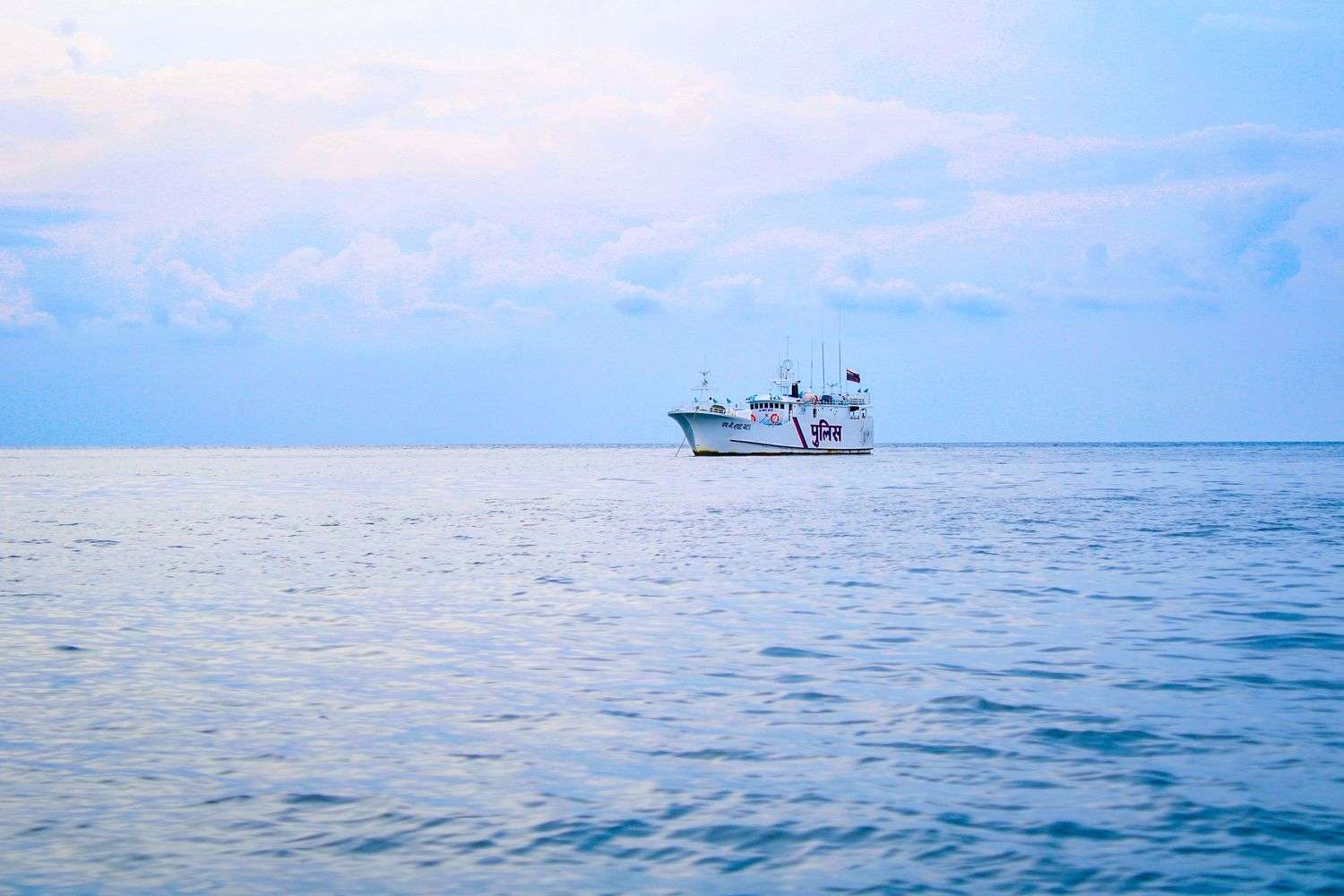 Coast Guard response boat on Mobile Bay with Dauphin Island in the background