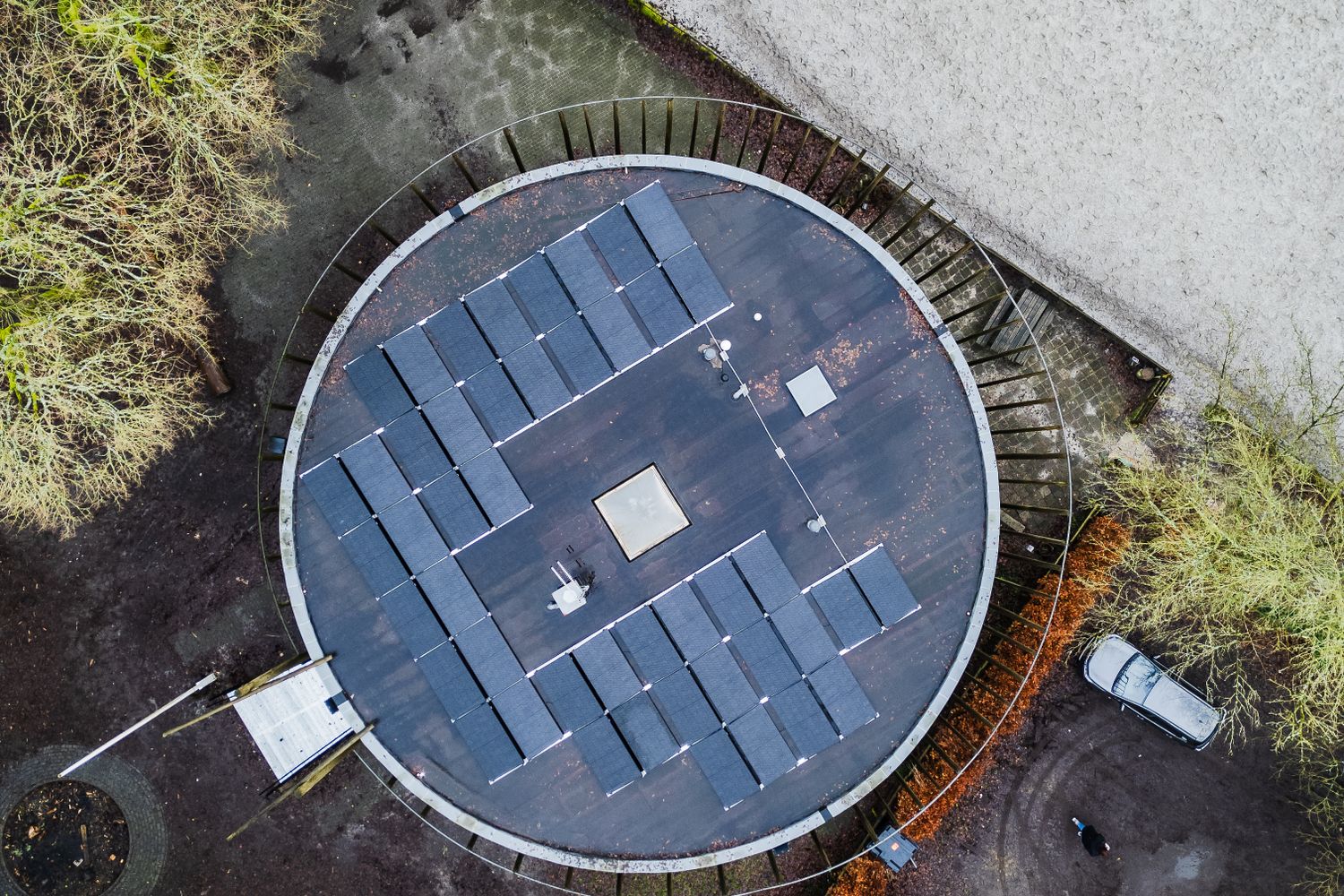 A shipping container being converted into a solar-powered computer classroom by students