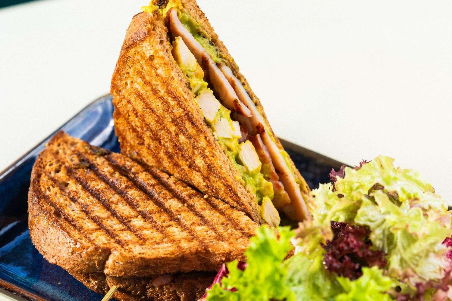 A plate of chicken salad with crackers
