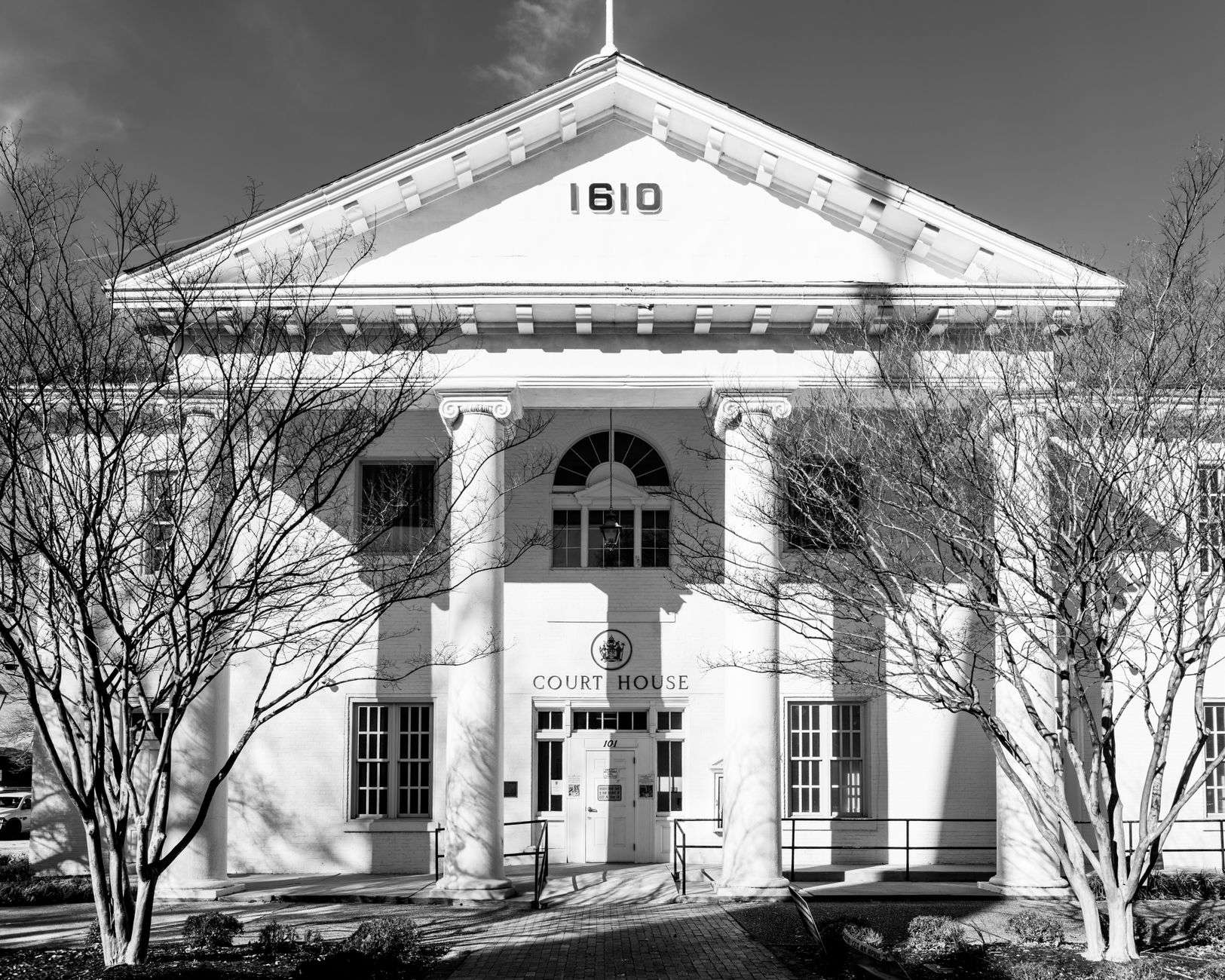 The exterior of a county courthouse building with columns