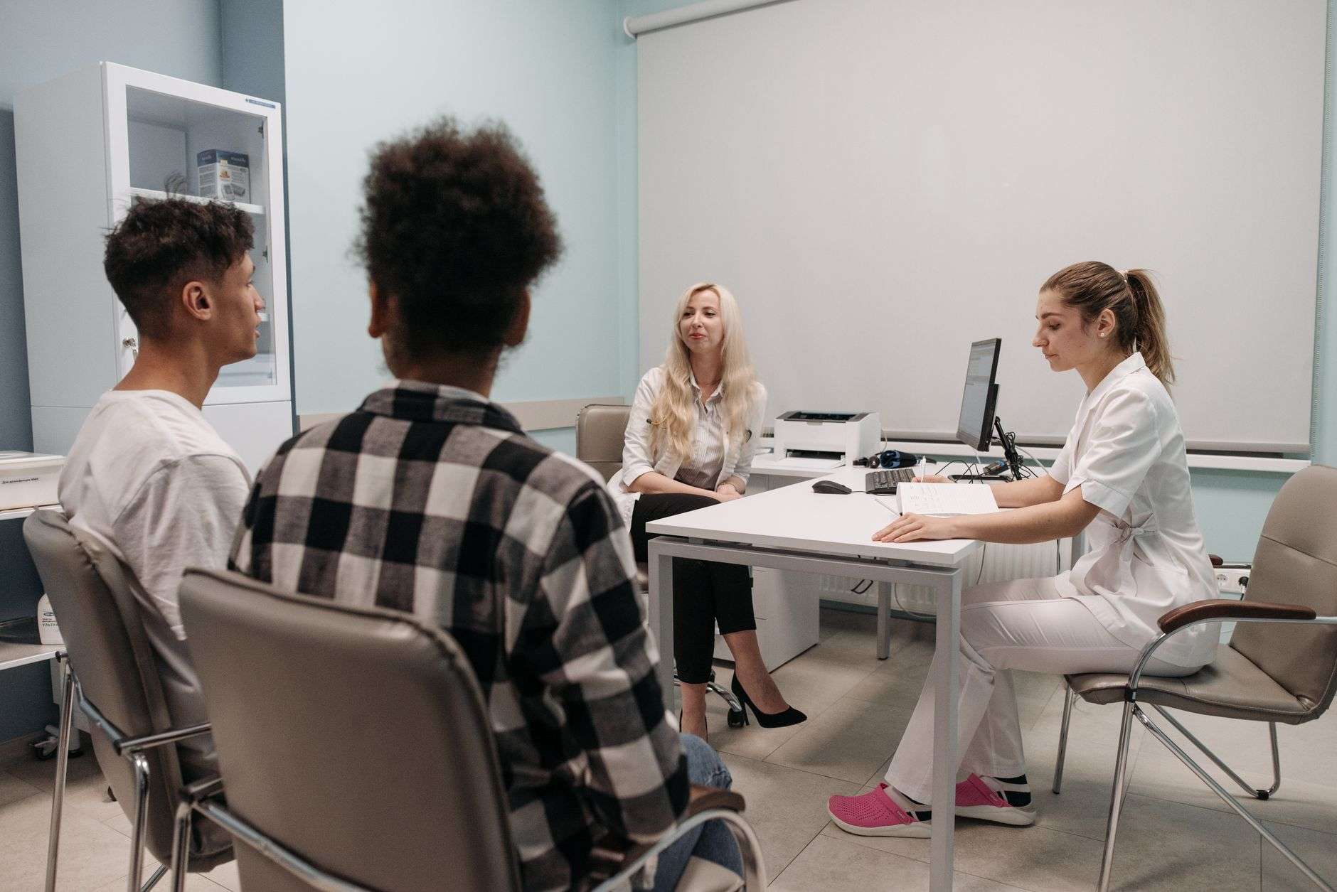 Doctor speaking with a patient during a community health center appointment