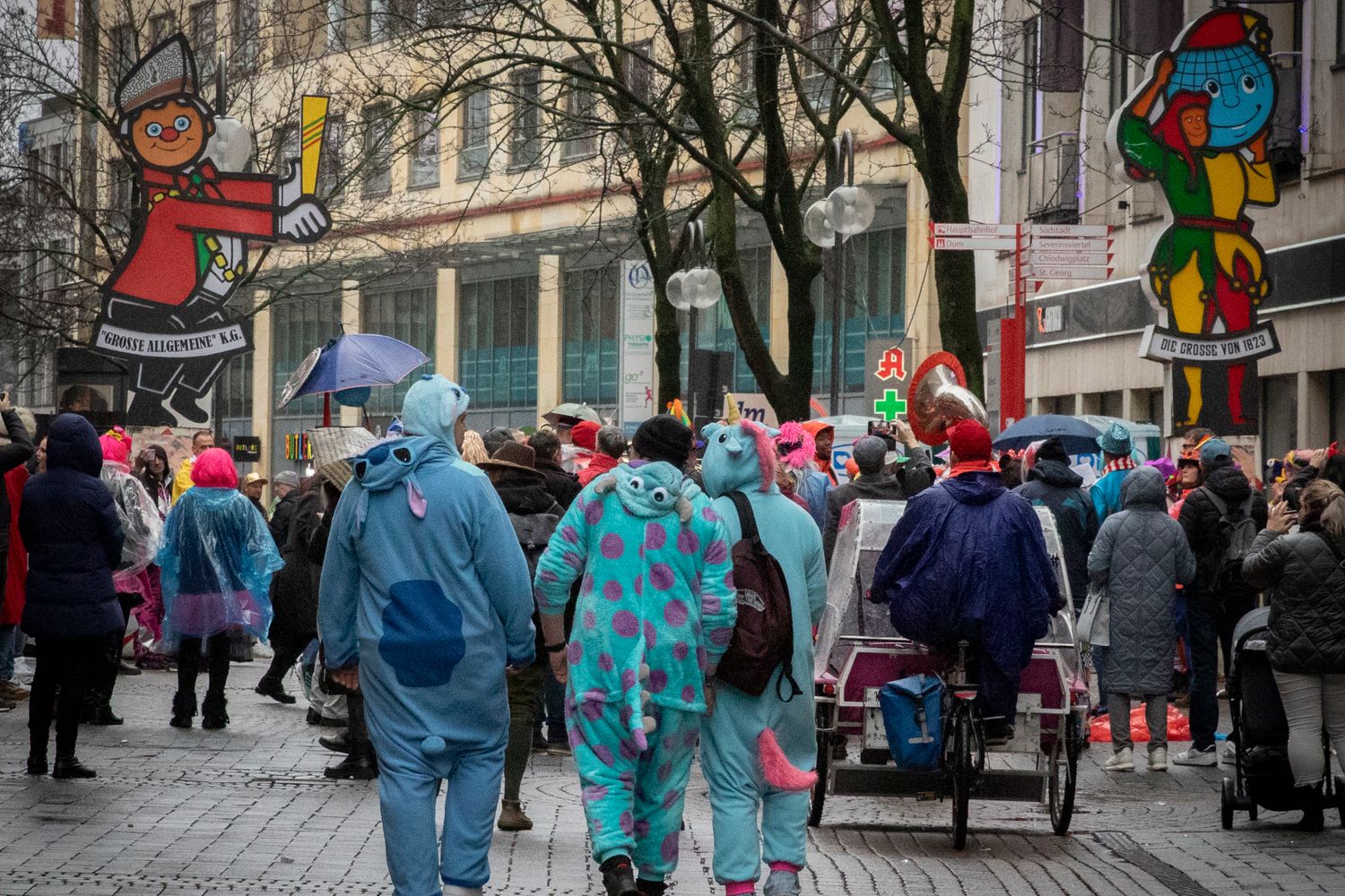 Large crowd celebrating at a Mobile Mardi Gras pre-parade party