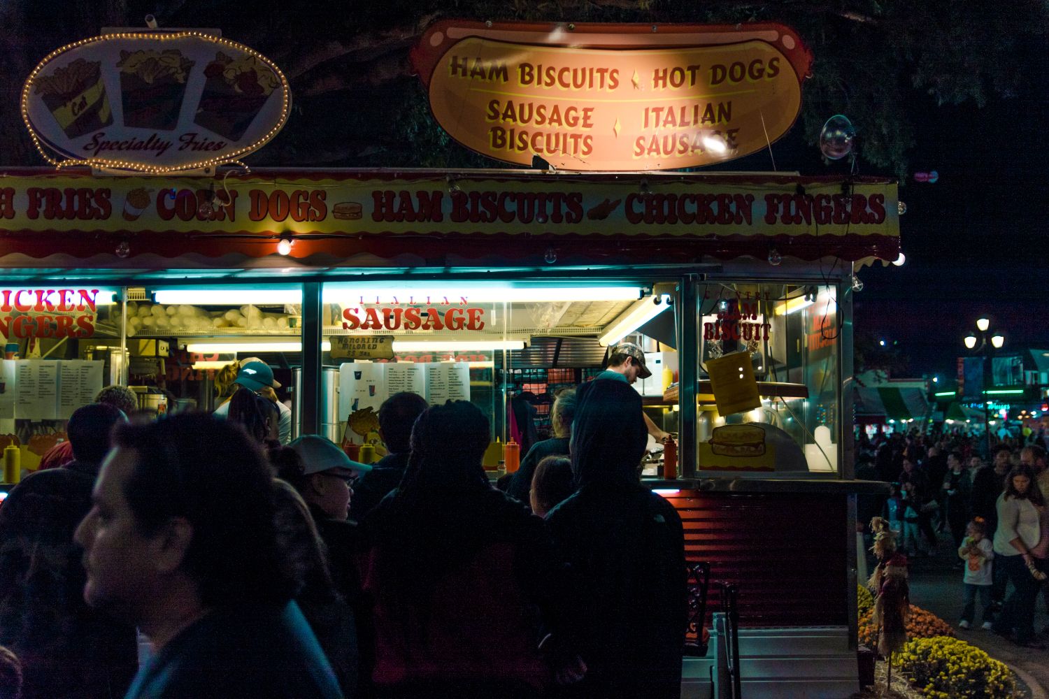 Crowd of people enjoying food vendors at an outdoor festival