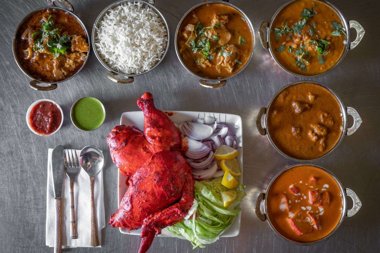 A platter of Indian food including tandoori dishes