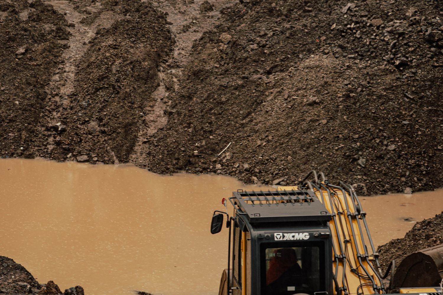Heavy equipment working at a dirt pit excavation site