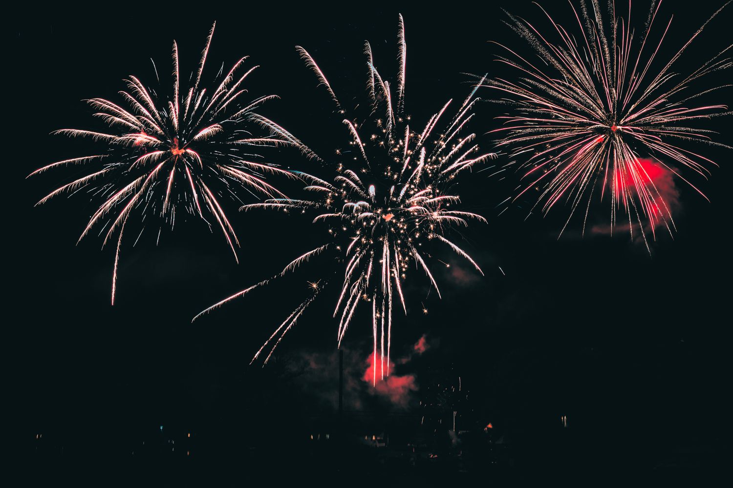 Colorful fireworks burst in the night sky during an Independence Day celebration