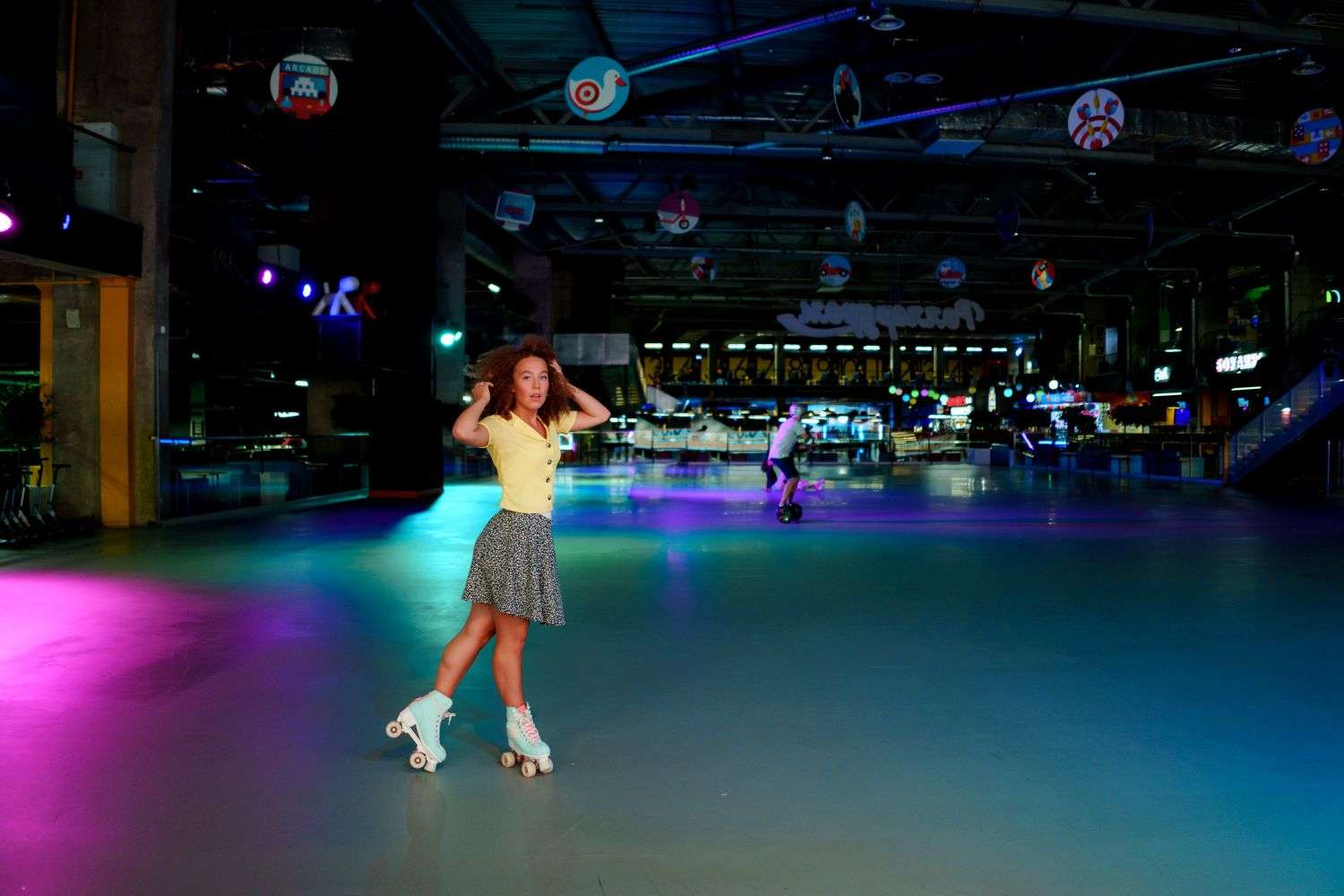 Roller skaters on an indoor rink