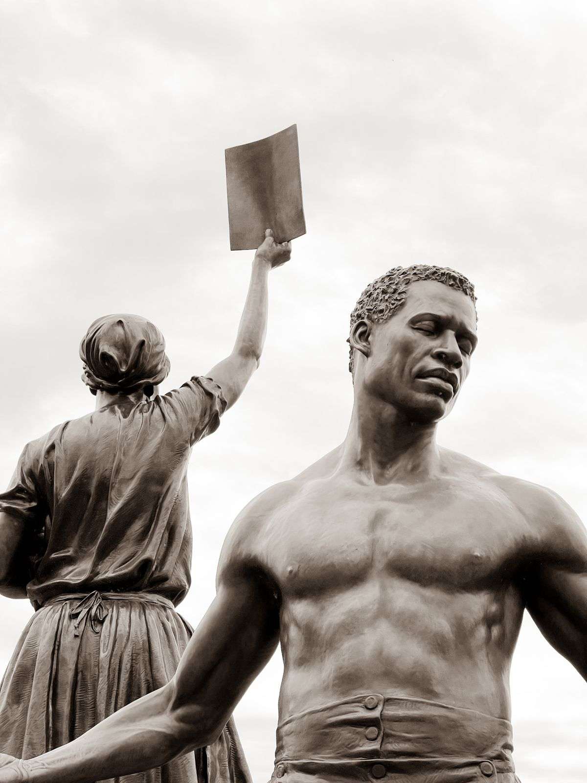 Bronze statues of the Emancipation and Freedom Monument depicting figures symbolizing freedom and resilience