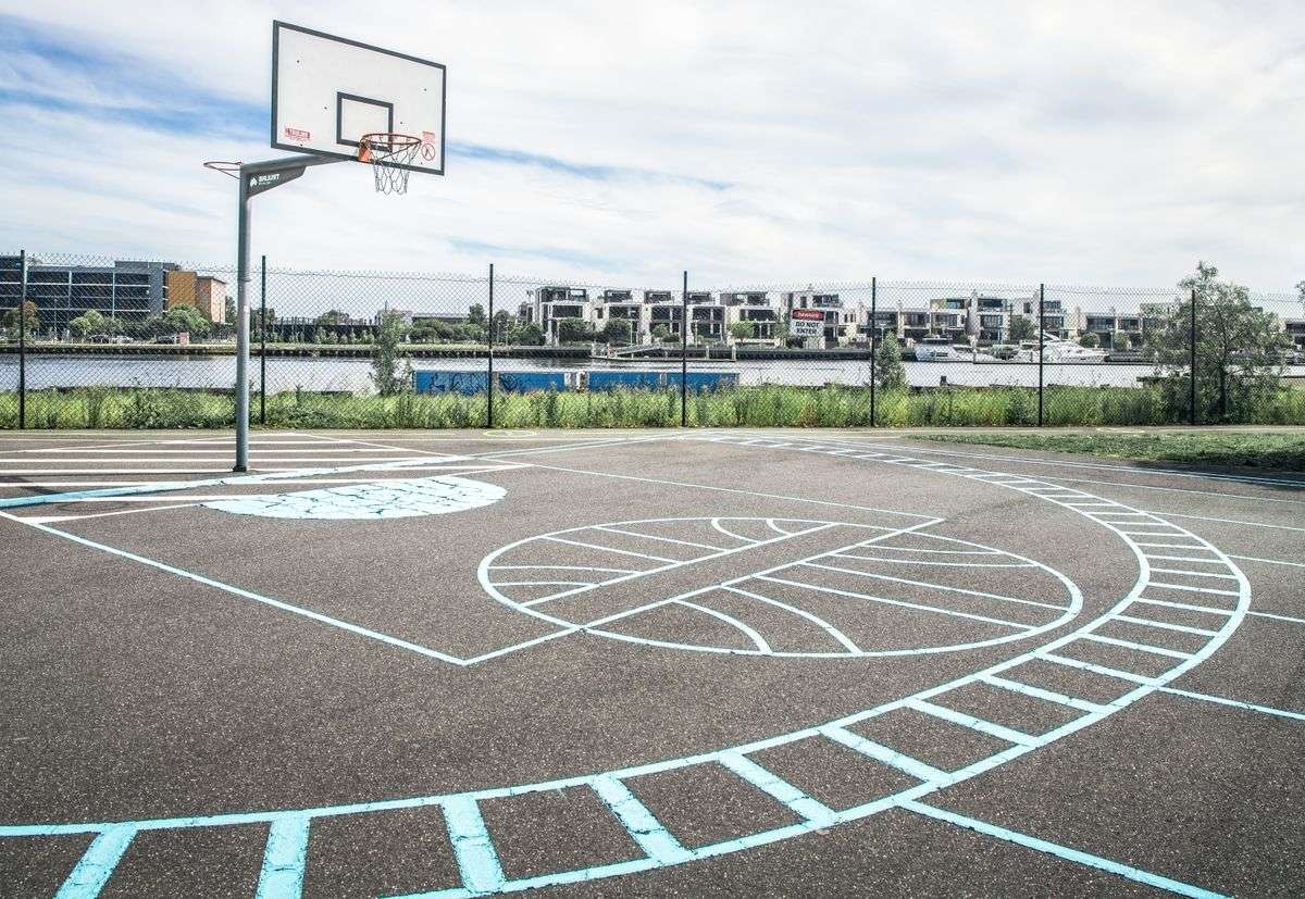 An empty outdoor basketball court with no players