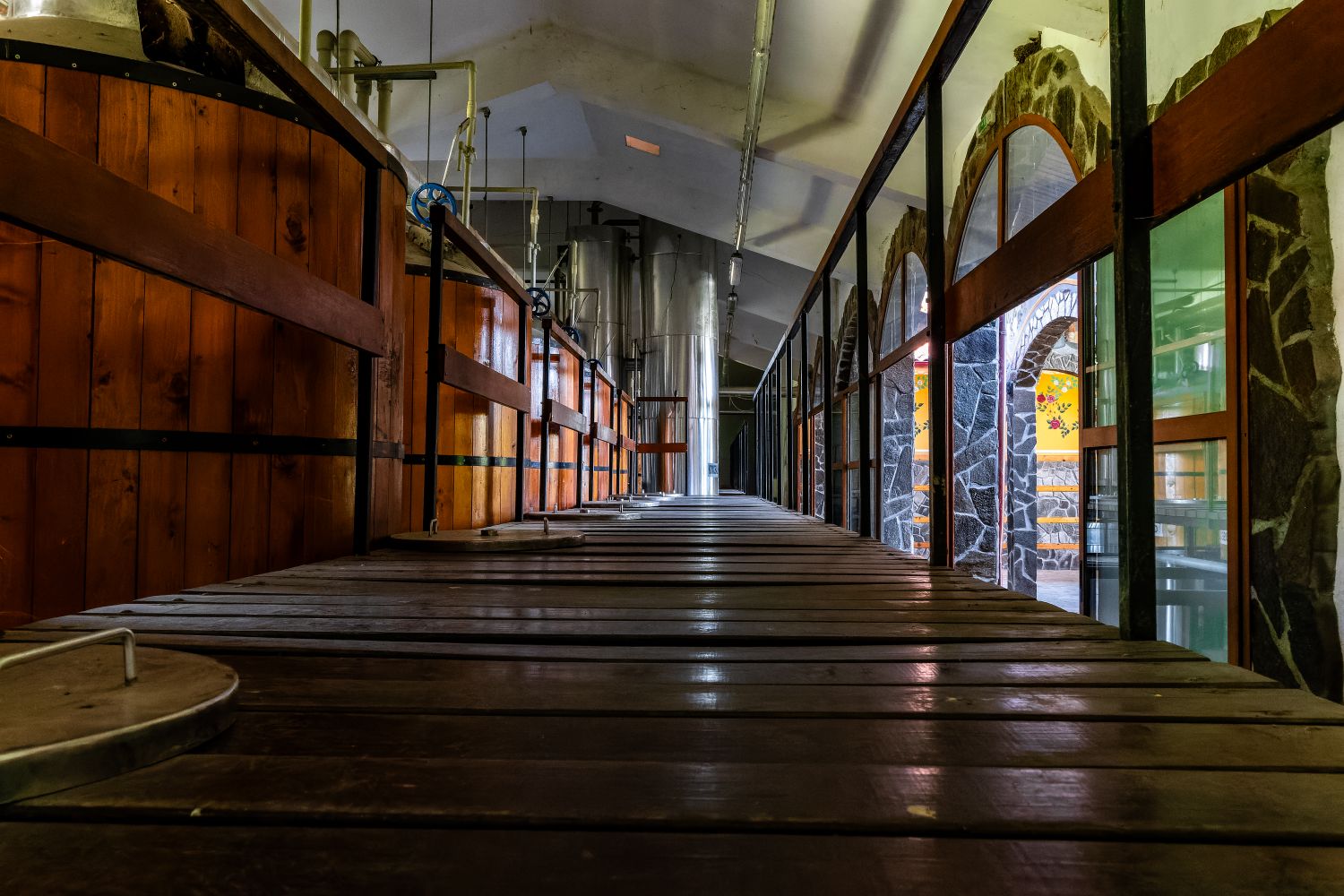 Shiny brewing kettles and fermenting tanks inside a new craft brewery