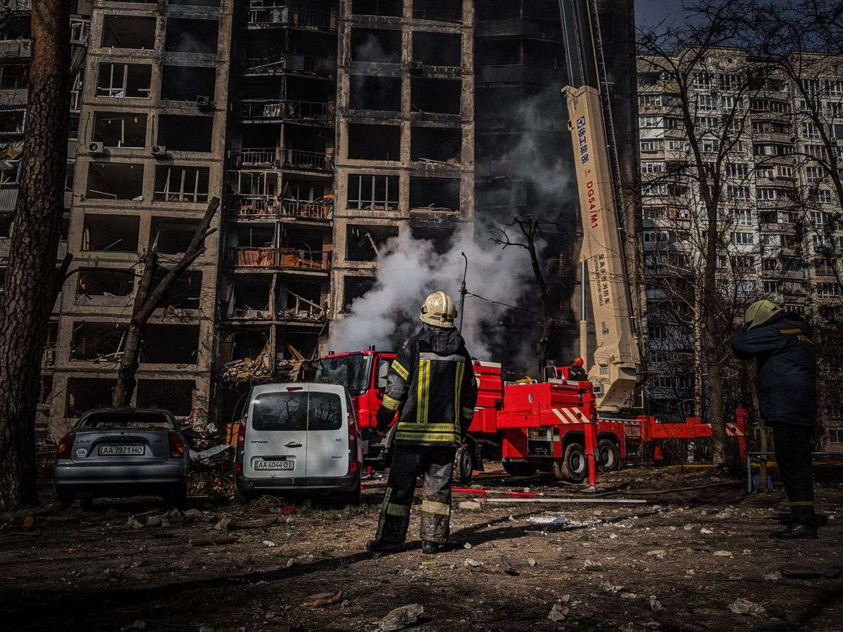 Firefighters responding at the scene of a fire at an apartment building