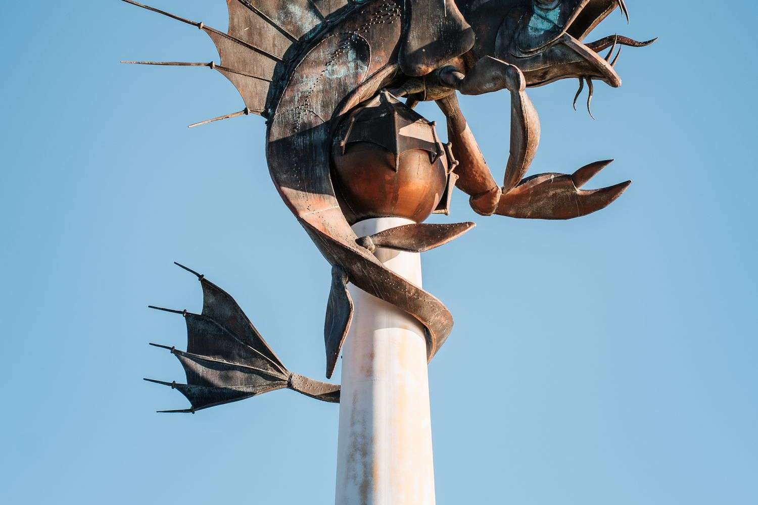 A metal sculpture of a sea creature on display
