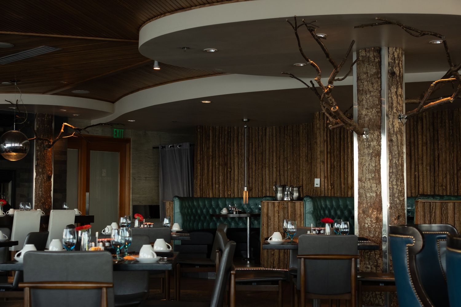 A restaurant dining room with spaced tables during the pandemic