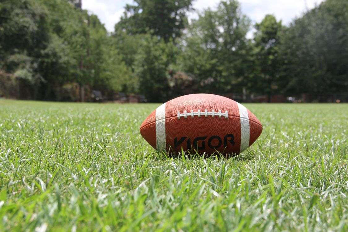 Green football field with yard lines