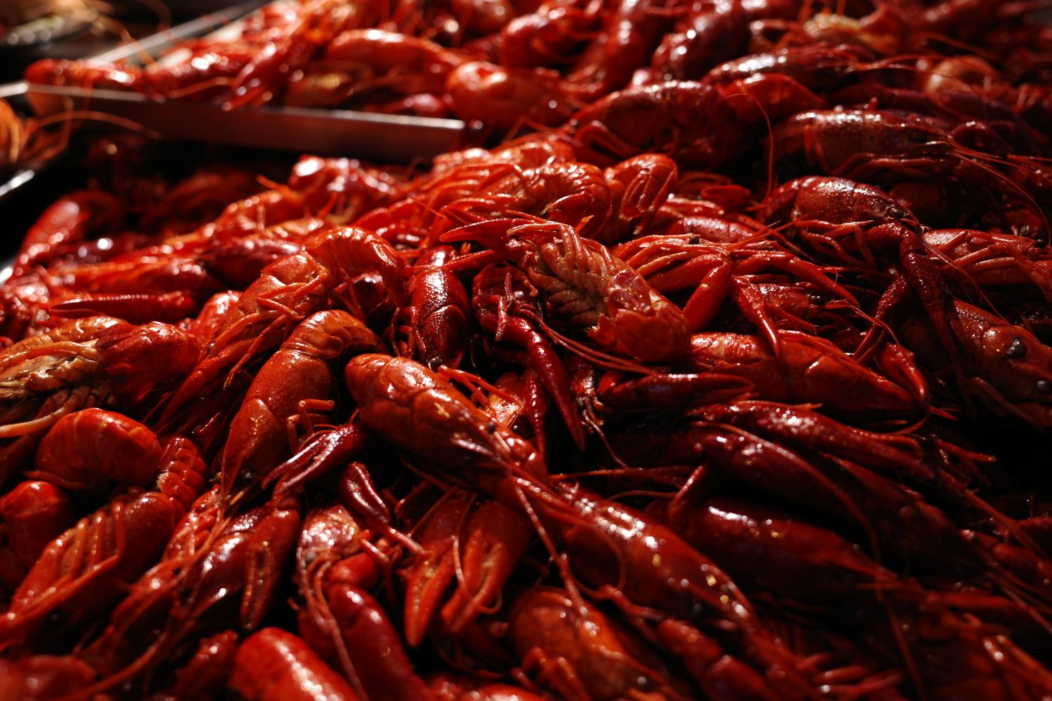 A spread of boiled crawfish on a table ready to eat