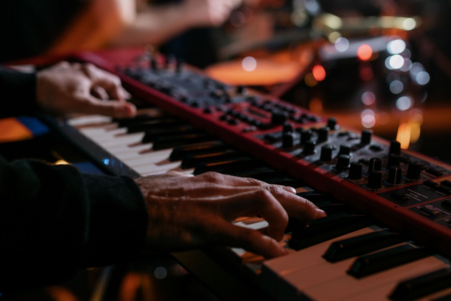 Electronic band performing with synths and brass at a downtown Mobile venue