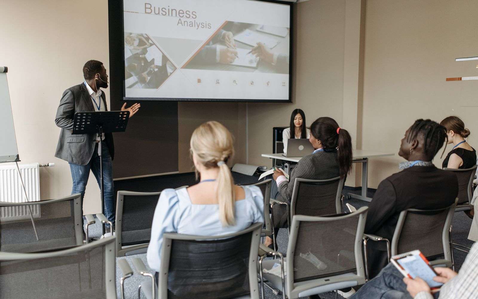 Business professionals discussing financial documents in a workshop setting