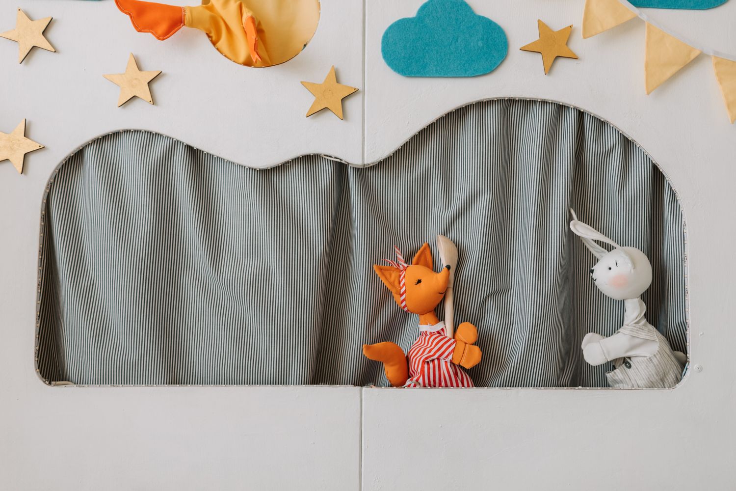 Children watching a puppet show at a storytime event